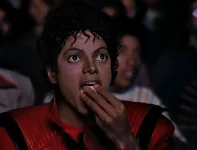 michael-jackson-eating-popcorn-in-a-theatre-with-color-v0-ryzsj91uah251.webp